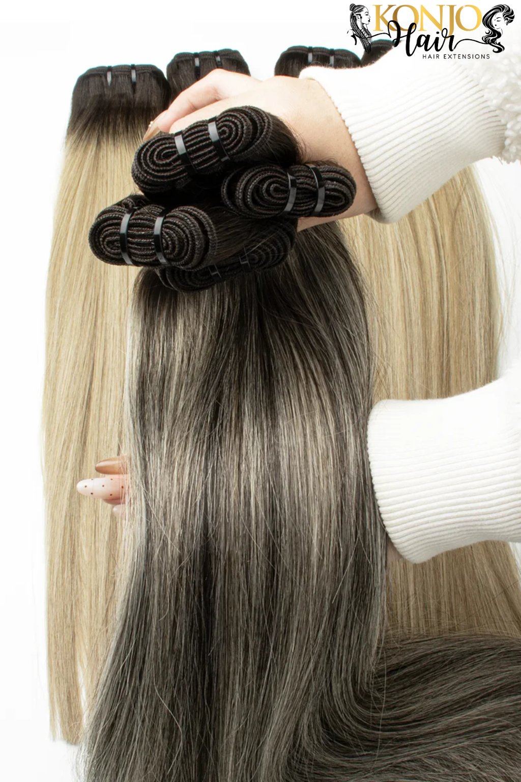 2/613/2 human hair bundles held in hand showing thickness and color blend
