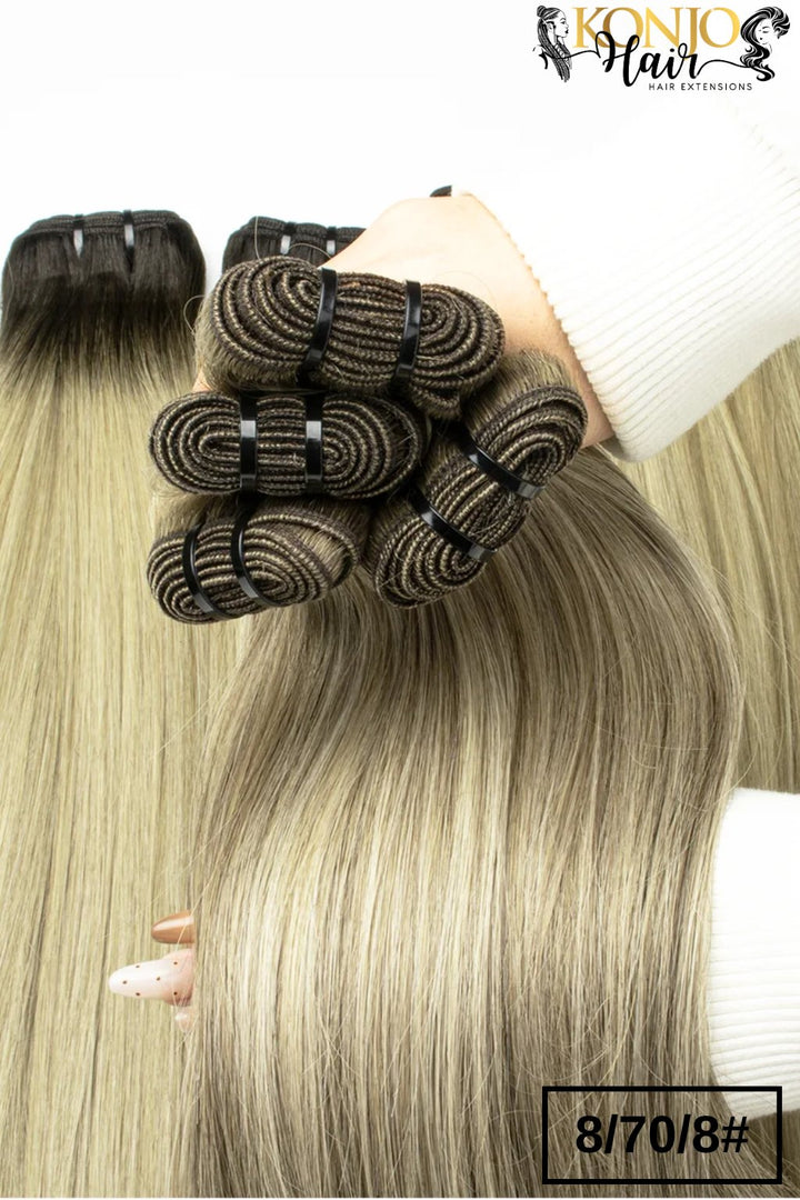 8/70/8 straight human hair bundles held in hand showing thickness and color blend